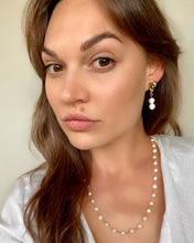 Two pearl drop earrings